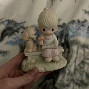 Precious moments dog and little girl statue on bench